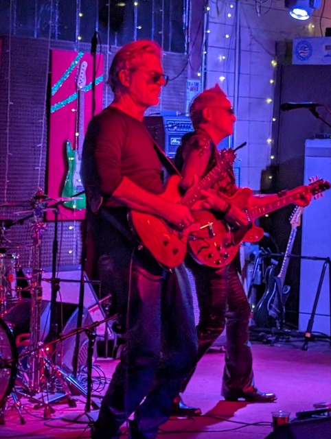 Bob and Rik locked in on stage