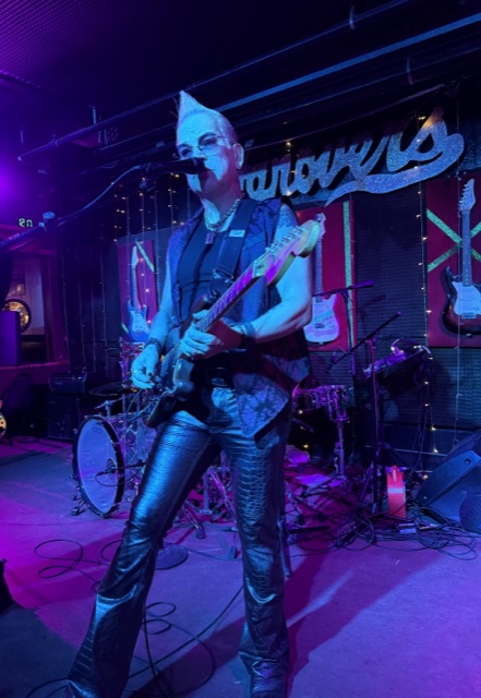 Rik Avalos full-length on stage at Hanover's
